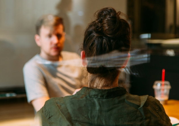 person-sitting-in-a-chair-in-front-of-a-man.jpg person sitting in a chair in front of a man